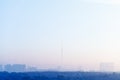 Blue sunrise sky over city and TV tower in winter Royalty Free Stock Photo