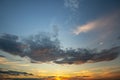 Blue sunset sky covered with white puffy clouds Royalty Free Stock Photo