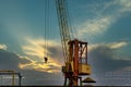 Blue sunset sky after five big high cranes under a new construction site of high-rise building against blue sunset sky Royalty Free Stock Photo