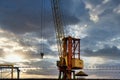 Blue sunset sky after five big high cranes under a new construction site of high-rise building against blue sunset sky Royalty Free Stock Photo