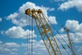 Blue sunset sky after five big high cranes under a new construction site of high-rise building against blue sunset sky Royalty Free Stock Photo