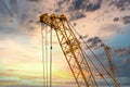 Blue sunset sky after five big high cranes under a new construction site of high-rise building against blue sunset sky Royalty Free Stock Photo