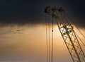 Blue sunset sky after five big high cranes under a new construction site of high-rise building against blue sunset sky Royalty Free Stock Photo