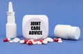 On the blue surface of the pill, capsule, spray, jar and cube with the inscription - joint care advice