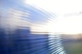 Blue surface of striped polycarbonate with a reflection of the blue distance of the city