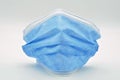 Blue surgical mask, isolated on white background Royalty Free Stock Photo
