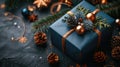 Blue Surprise: Festive Gift Box and Decorations on Dark Background with Copy Space for Christmas, Birthday or Holiday Present Royalty Free Stock Photo