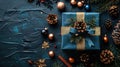 Blue Surprise: Festive Gift Box and Decorations on Dark Background with Copy Space for Christmas, Birthday or Holiday Present Royalty Free Stock Photo