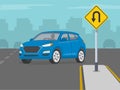 Blue suv turning left on highway. Yellow u-turn road sign allows to make a u-turn.