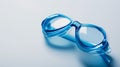 Blue swimming goggles on a plain white background Royalty Free Stock Photo