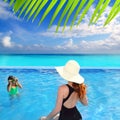 Blue swimming pool caribbean view mother daughter