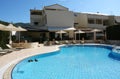 Blue swimming-pool in Greek hotel. Royalty Free Stock Photo