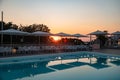 Blue swimming pool in a spa hotel in southern Italy at sunset Royalty Free Stock Photo