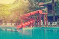 blue swimming pool with water slide at hotel