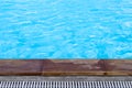 Blue swimming pool and wood plank edge on background Royalty Free Stock Photo