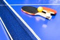 Blue table tennis or ping pong. Close-up ping-pong net. Close up ping pong net and line. Two table tennis or ping pong rackets or Royalty Free Stock Photo