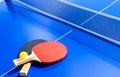 Blue table tennis or ping pong. Close-up ping-pong net. Close up ping pong net and line. Two table tennis or ping pong rackets or Royalty Free Stock Photo