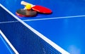 Blue table tennis or ping pong. Close-up ping-pong net. Close up ping pong net and line. Two table tennis or ping pong rackets or Royalty Free Stock Photo