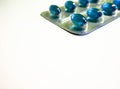 Blue tablets on a light background Royalty Free Stock Photo