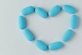 blue tablets on a light background, vitamins and medicines Royalty Free Stock Photo