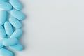 blue tablets on a light background, vitamins and medicines Royalty Free Stock Photo