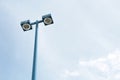 blue tall light post with two turned off circle pot light in squares opposite. p Royalty Free Stock Photo