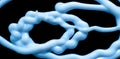 blue tangle of stream of liquid silicone on a black background