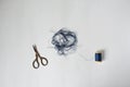 Blue tangle thread spool and scissors Royalty Free Stock Photo
