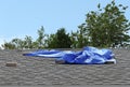 Blue Tarp Covering Residential Roof Leak Royalty Free Stock Photo