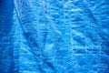 blue tarpaulin texture on a sunny day Royalty Free Stock Photo