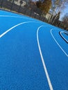 Blue tartan running track curve