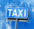 Blue taxi street sign isolated against blue sky