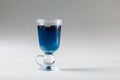 Blue tea Anchan in an Irish glass on a gray background. Cup of Butterfly pea tea, pea flowers, blue pea. Healthy, detox Royalty Free Stock Photo