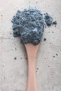 Blue tea matcha in a spoon on concrete surface. Close up shot Royalty Free Stock Photo