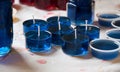 Blue tealight candles being made Royalty Free Stock Photo