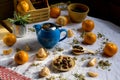 Blue teapot, tea and mandarin