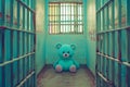Blue teddy bear toy in prison Royalty Free Stock Photo