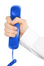 Blue telephone receiver with hand Royalty Free Stock Photo