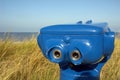 Blue telescope on the beach Royalty Free Stock Photo