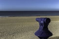 Blue telescope with the beach in the background Royalty Free Stock Photo