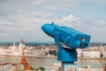 Blue telescope and blurred Budapest city on background Royalty Free Stock Photo