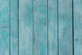 Blue Temperate turquoise old wooden fence. wood palisade background. planks texture, weathered surface Royalty Free Stock Photo