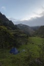 Blue tend camping near to a forest mountain in middle of colombian andean mountains valley Royalty Free Stock Photo