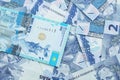 A blue tenge note from Kazakhstan with Brazilian two reais bank notes