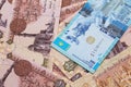 A blue tenge note from Kazakhstan with Egyptian one pound bank notes