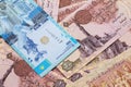 A blue tenge note from Kazakhstan with Egyptian one pound bank notes