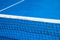 Blue tennis court with net. Empty sport field photo. Hard court for lawn tennis. Summer sport activity game outdoor Royalty Free Stock Photo