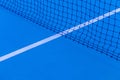 Blue tennis court surface, sport background..Detail of a tennis court.Tennis court with net background Royalty Free Stock Photo
