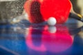 blue tennis table with two rackets, white net ball Royalty Free Stock Photo