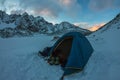 Blue tent in the base camp in the mountains